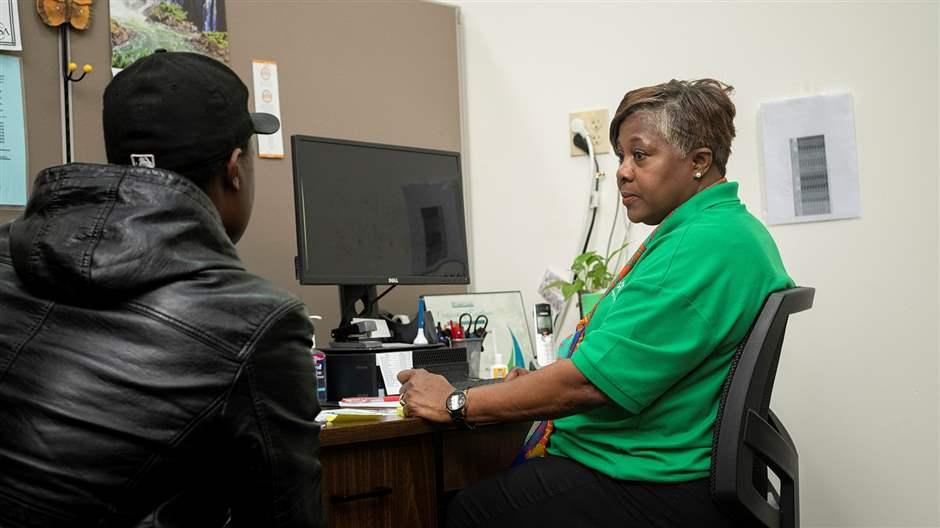 Carmela Peterkin-Wilson, a navigator with the Maryland Health Connection, enrolls a resident in a health insurance plan in 2019. Carmela Peterkin-Wilson, a navigator with the Maryland Health Connection, enrolls a resident in a health insurance plan in 2019.
