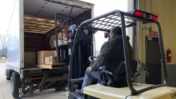 Loading supplies into truck Loading supplies into truck