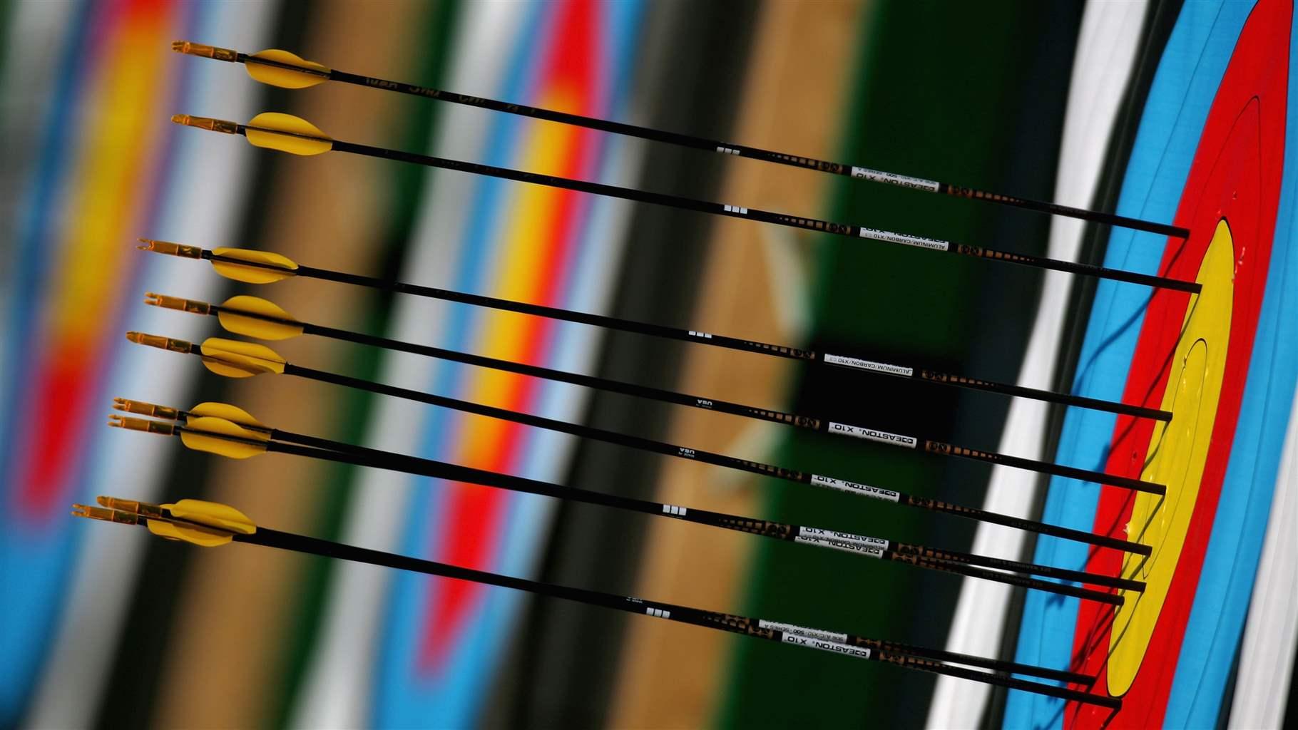 Arrows are seen embedded in a target during practice for the women's individual eliminations match on August 17, 2004 during the Athens 2004 Summer Olympic Games at Panathinaiko Stadium in Athens, Greece. 