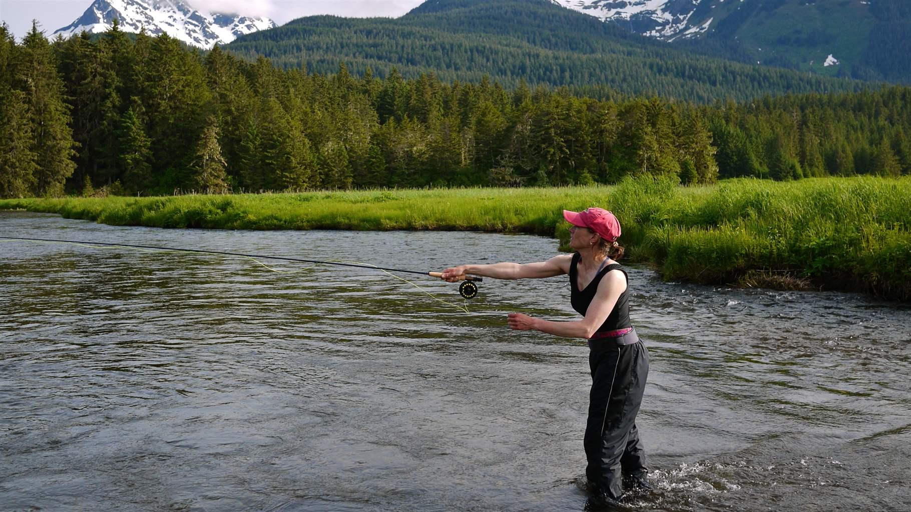 A woman fly-fishes on Admiralty Creek in the Tongass National Forest. 