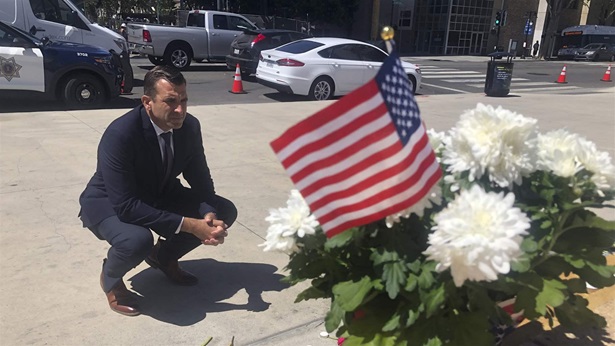 In this May 27, 2021, file photo, San Jose Mayor Sam Liccardo stops to view a makeshift memorial for the rail yard shooting victims in front of City Hall in San Jose, Calif. In this May 27, 2021, file photo, San Jose Mayor Sam Liccardo stops to view a makeshift memorial for the rail yard shooting victims in front of City Hall in San Jose, Calif.
