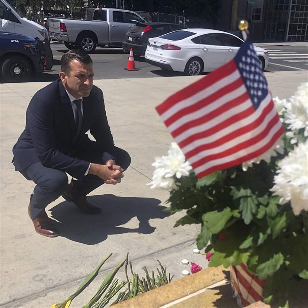 In this May 27, 2021, file photo, San Jose Mayor Sam Liccardo stops to view a makeshift memorial for the rail yard shooting victims in front of City Hall in San Jose, Calif. In this May 27, 2021, file photo, San Jose Mayor Sam Liccardo stops to view a makeshift memorial for the rail yard shooting victims in front of City Hall in San Jose, Calif.
