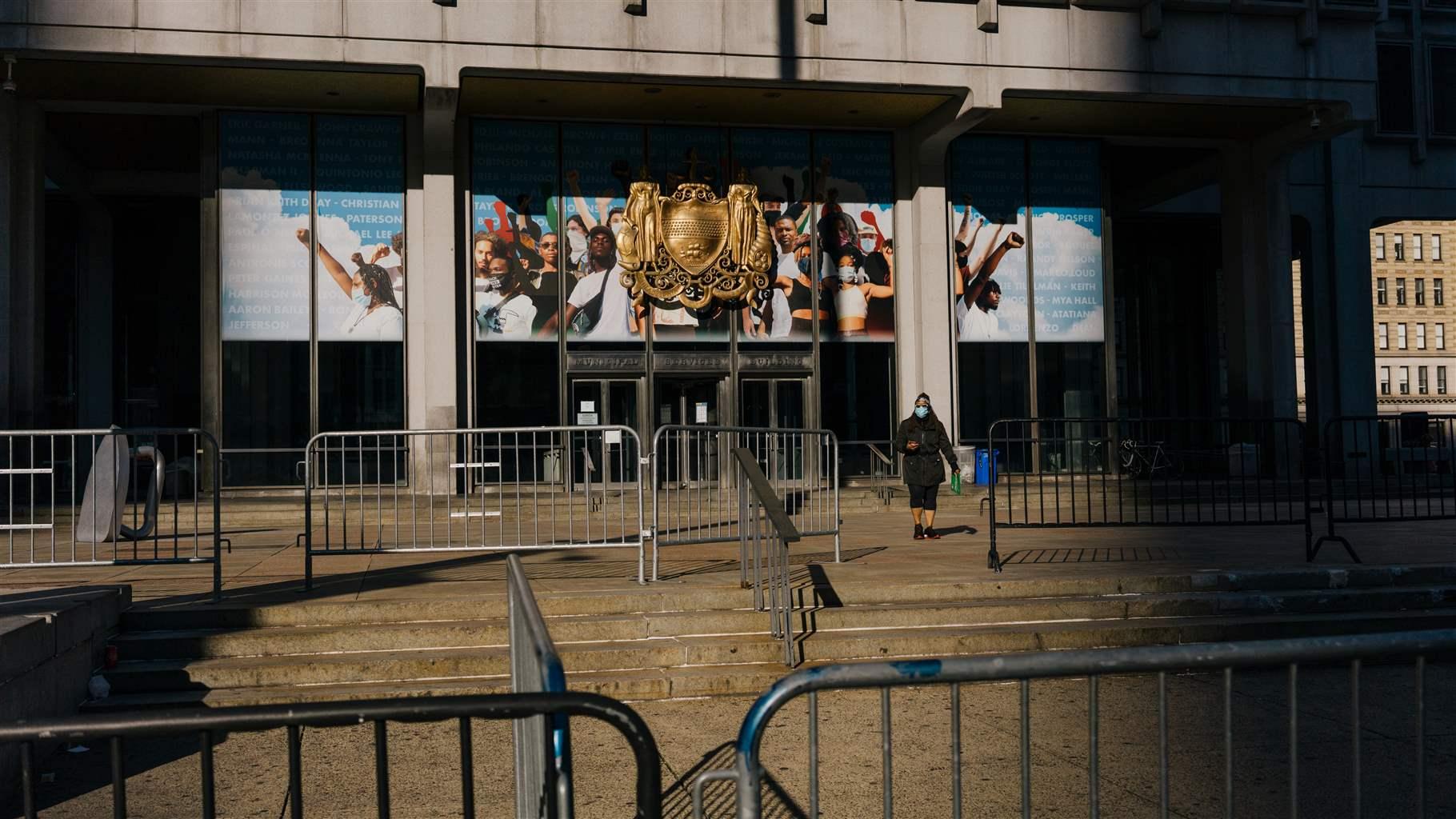 A woman leaves the Miniciple Services Building on John F. Kennedy Blvd. in Philadelphia, Pa.