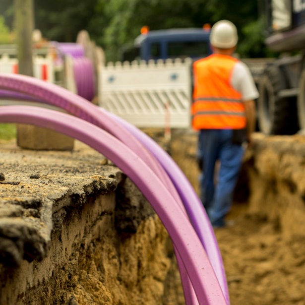 Workers digging a ditch for broadband cables. 