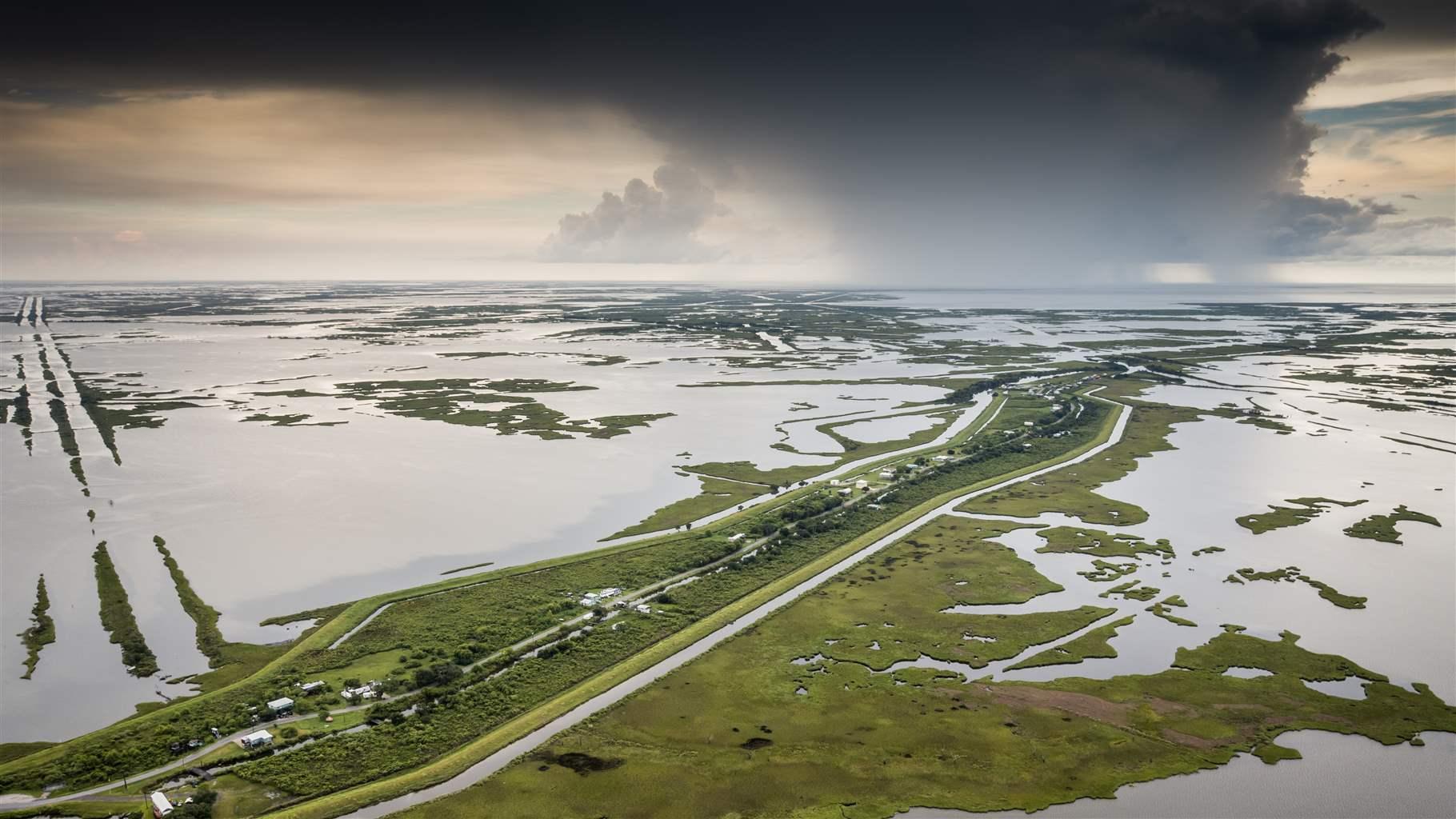 Storm clouds gather above Isle de Jean Charles in Terrebonne Parish, Louisiana. 