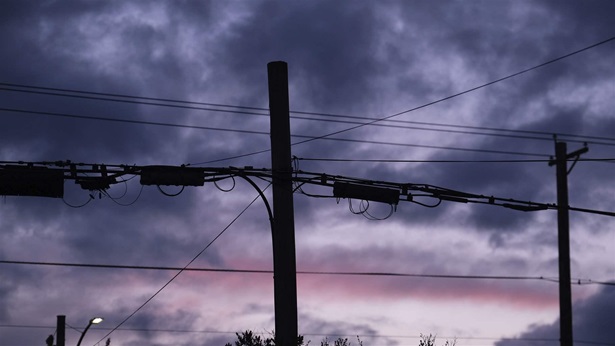 A utility pole carrying fiber optic internet cables pictured at sunset in Portland, Ore., on March 24, 2020.