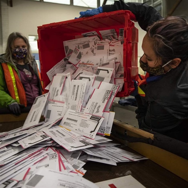 election workers process mail-in ballots election workers process mail-in ballots