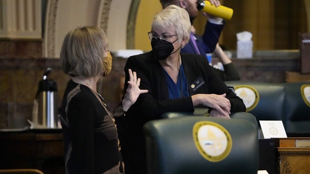 Colorado State Rep. Barbara McLachlan, left, confers with Rep. Cathy Kipp as the 2022 legislative session opened Wednesday, Jan. 12, 2022, in the State Capitol in Denver.