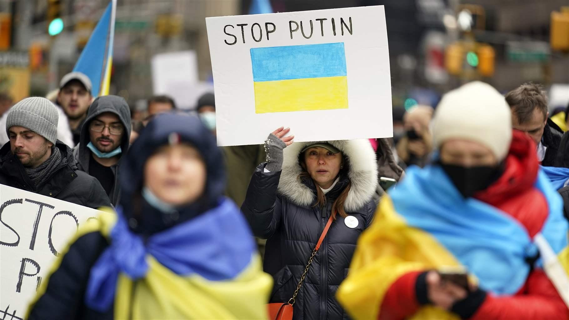 Pro-Ukraine demonstrators Pro-Ukraine demonstrators carrying signs as they march in New York City.