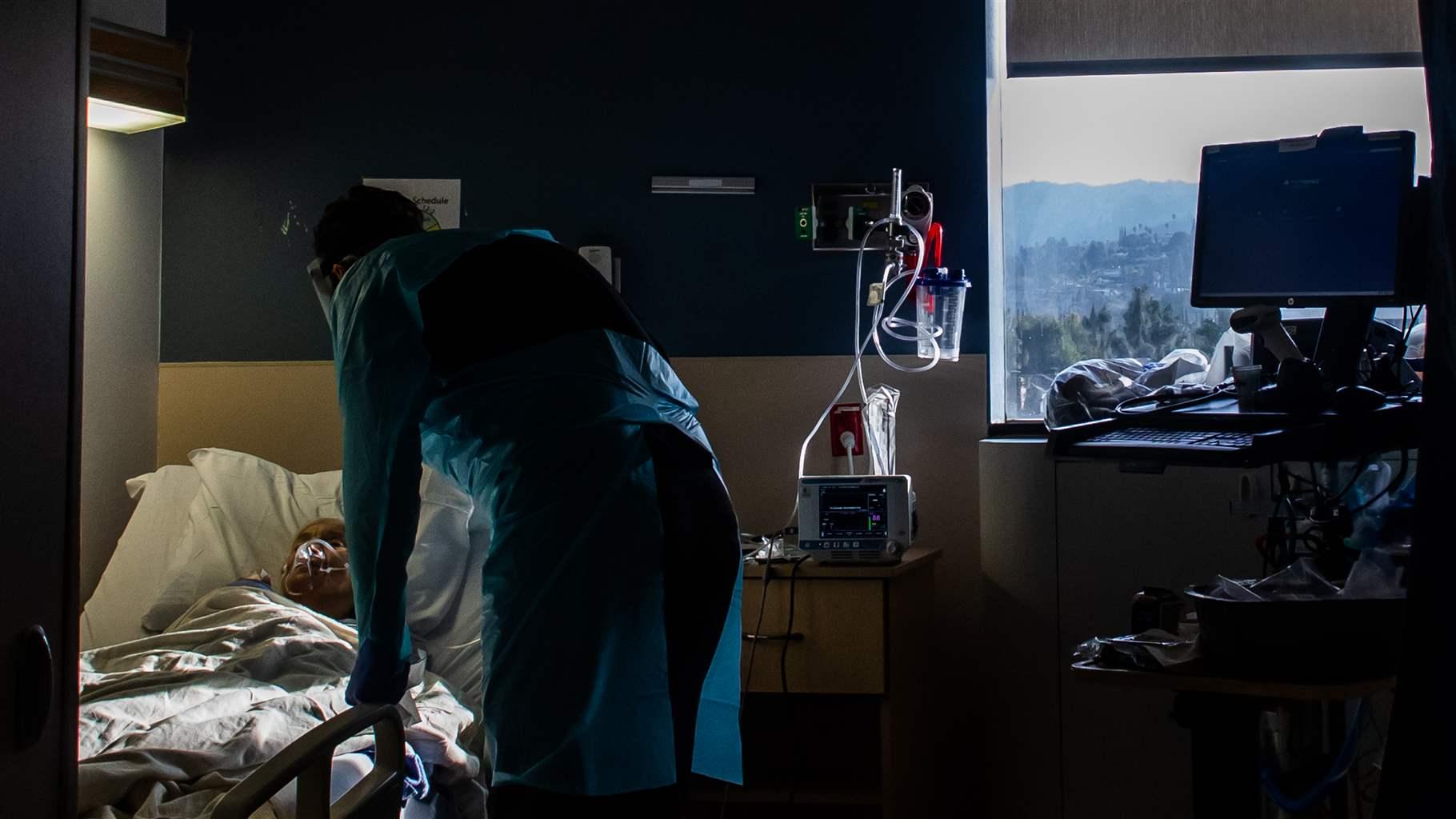 Medical Director of the Intensive Care Unit (ICU) Dr. Thomas Yadegar attends to a Covid-19 patients at Providence Cedars-Sinai Tarzana Medical Center in Tarzana, California on January 3, 2021. 