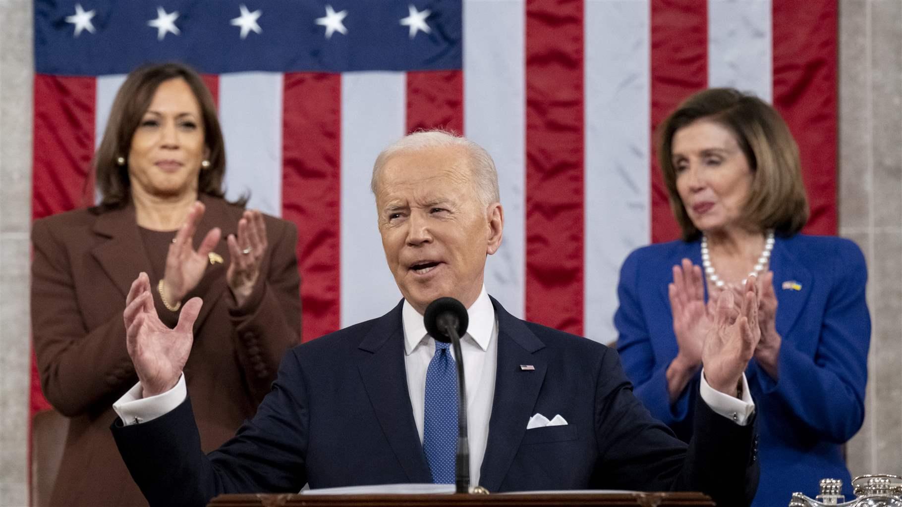 US President Joe Biden arrives to deliver the State of the Union address as U.S. Vice President Kamala Harris (L) and House Speaker Nancy Pelosi (D-CA) look on during a joint session of Congress in the U.S. Capitol House Chamber on March 1, 2022 in Washington, DC. 