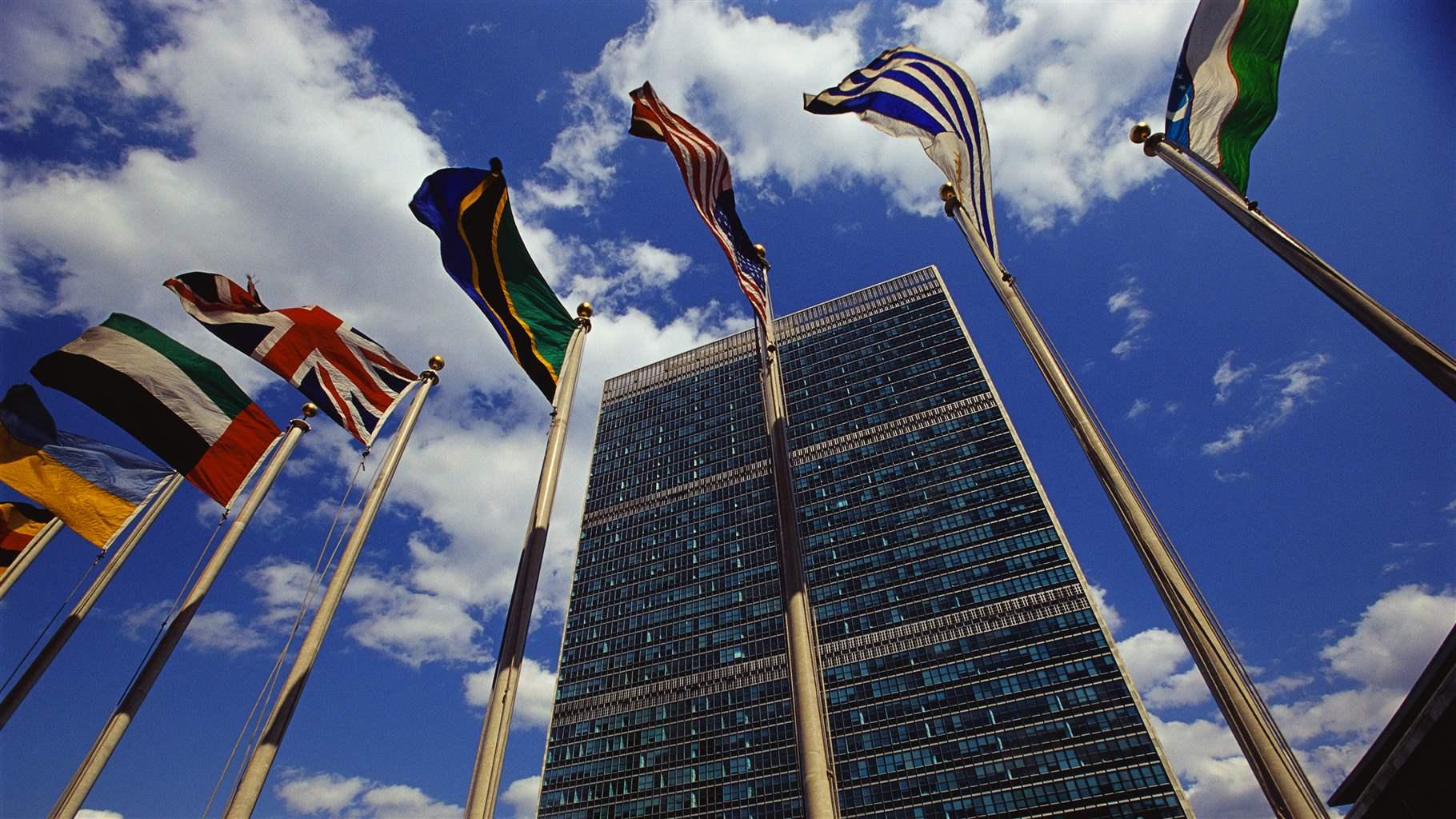 Flags fly outside the General Secretariat Building at the United Nations Headquarters.