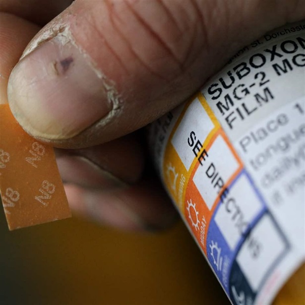 A patient displays his Suboxone prescription following his appointment at the Substance Use Disorders Bridge Clinic at Massachusetts General Hospital in Boston on April 27, 2018. 