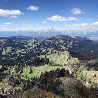 The view from atop Wyoming’s Mount Leidy shows jagged peaks rising in the distance; they belong to the state’s Teton Range