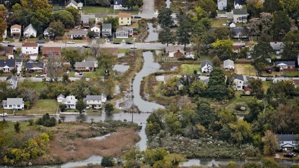The Wilson neighborhood is filled with water from Salters Creek during King Tide, one of the highest tides of the year, in Newport News, Va., on Saturday, November 6, 2021.