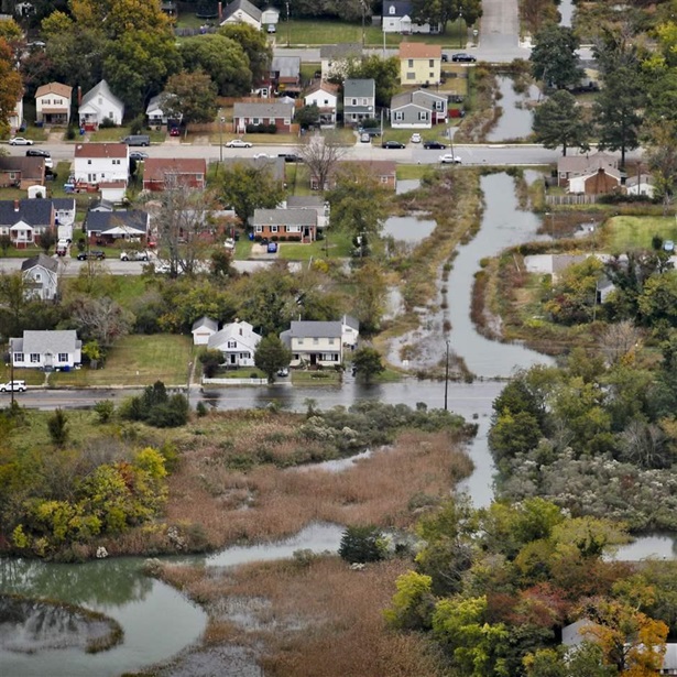 The Wilson neighborhood is filled with water from Salters Creek during King Tide, one of the highest tides of the year, in Newport News, Va., on Saturday, November 6, 2021.