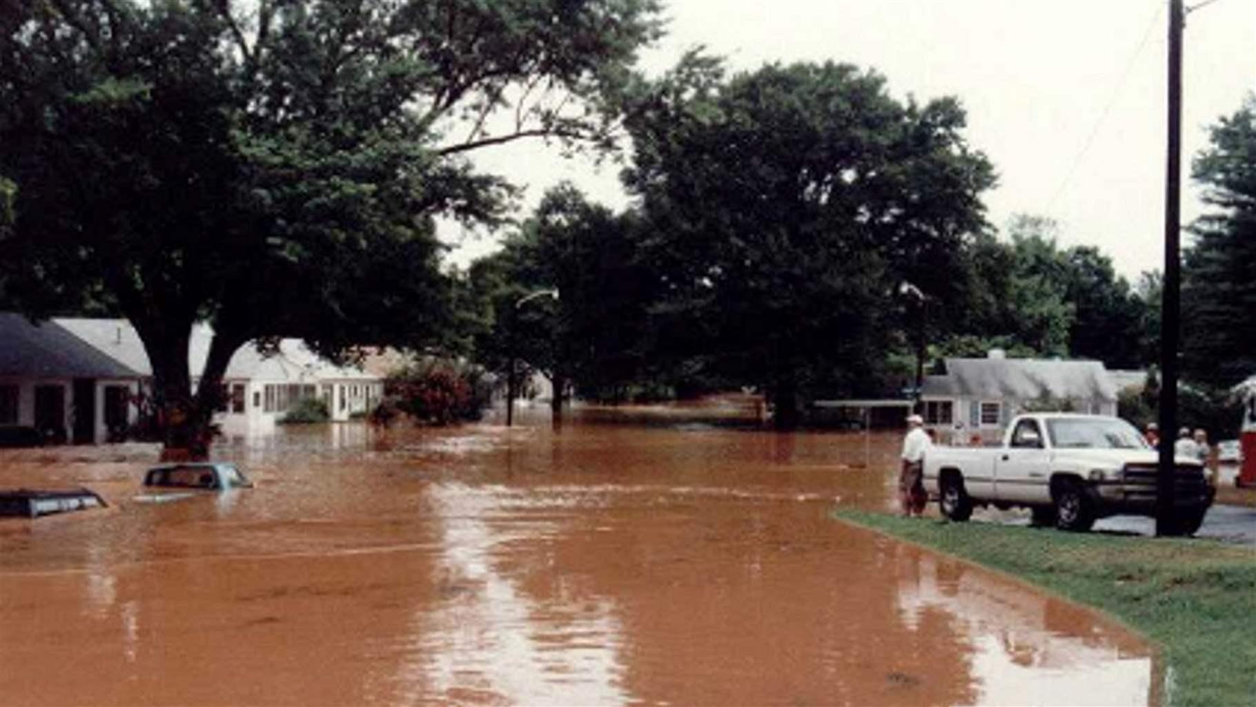 Westfield Road in Charlotte, North Carolina, during a flood on Aug. 4, 2011, left, and after Mecklenburg County’s Floodplain Buyout Program bought and removed homes on the street and converted the land into greenspace, right, which helps absorb excess water and provides environmental and recreational co-benefits.