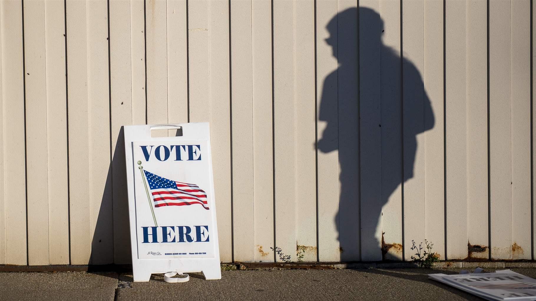 voter walks toward a polling place voter walks toward a polling place