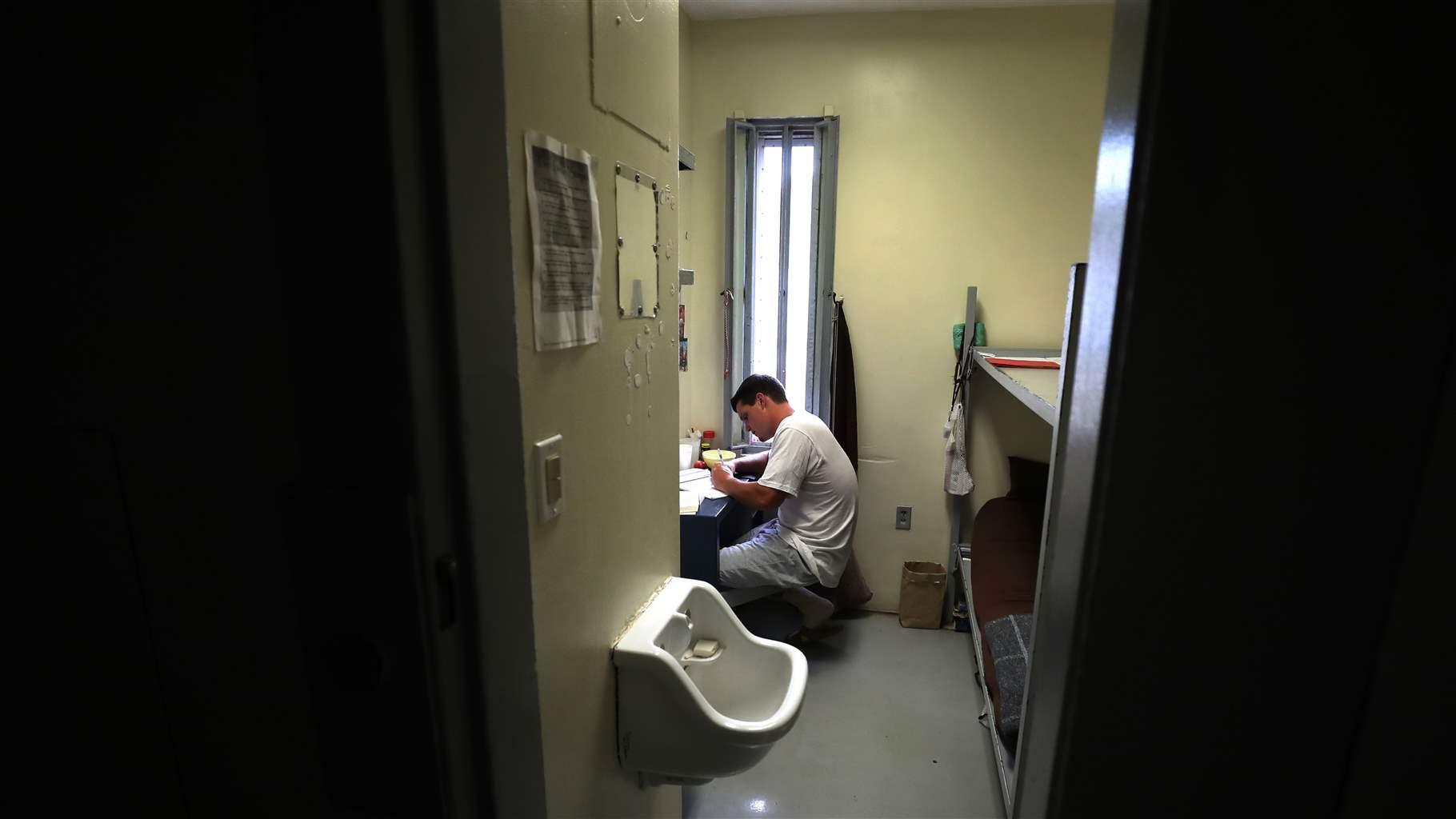 n his cell, inmate Chandler Lackey, 22, writes down on paper an Inventory of Resentments, a pilot program with a navigator (mentor) as part of STOP (Substance Treatment Opportunity Program), at the Worcester County House of Corrections in West Boylston, MA on Sep. 23, 2019. 