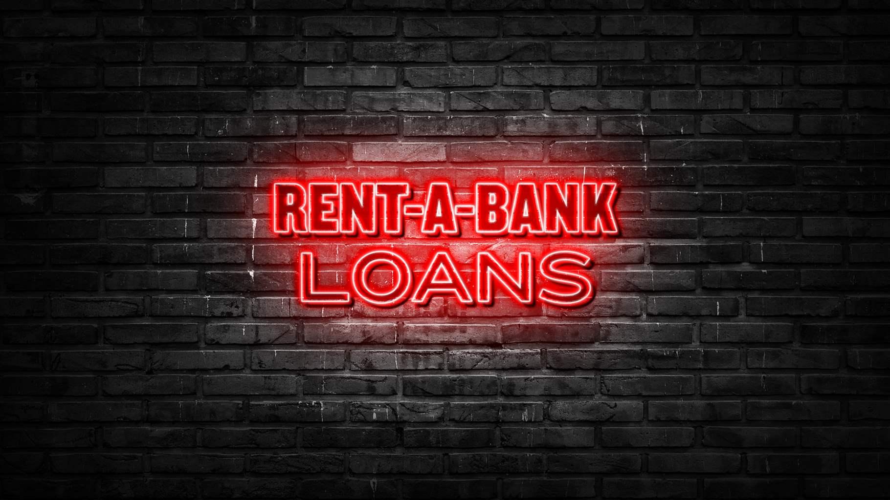 A neon red sign hung on a brick wall that says "rent-a-bank loans" 