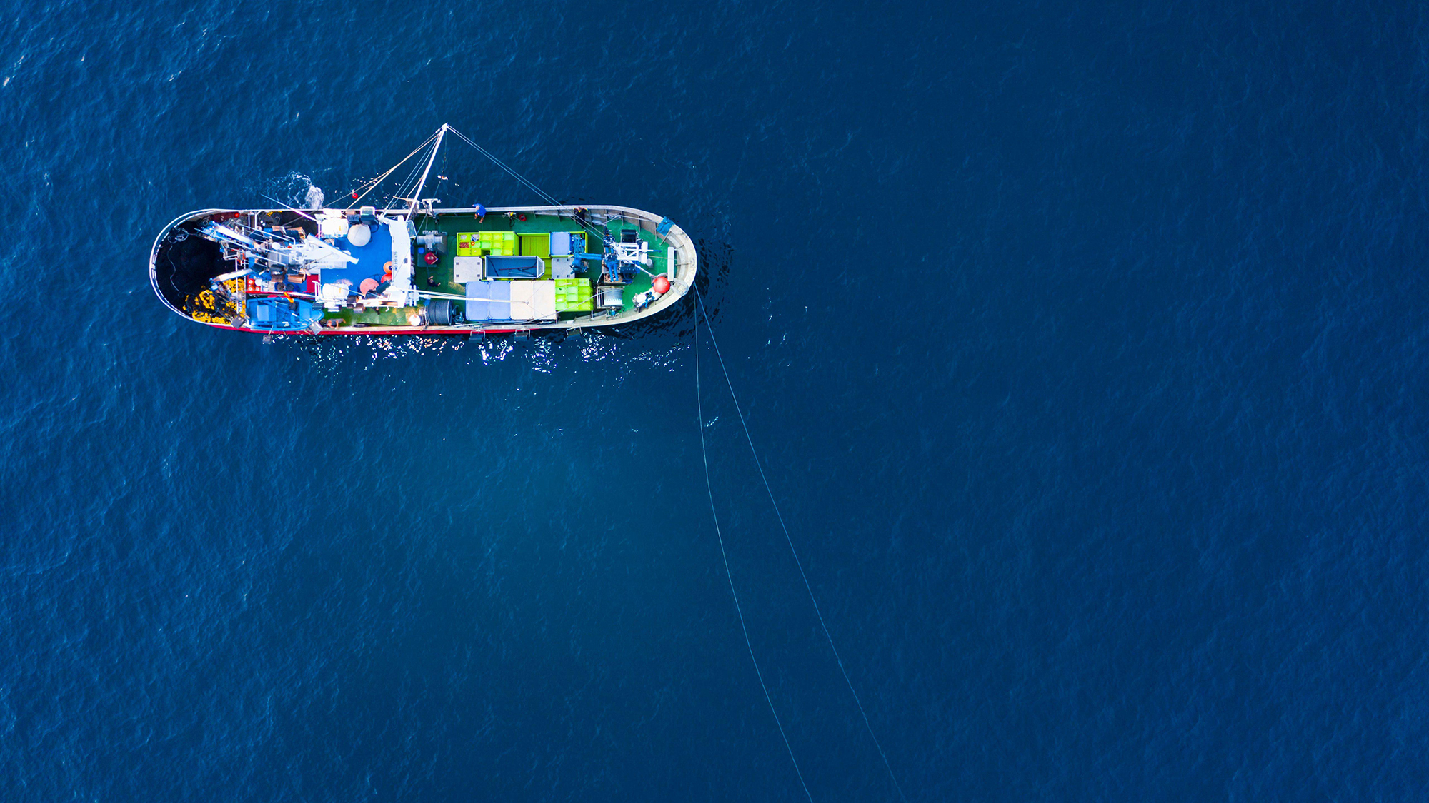 An aerial shot of a fishing boat.