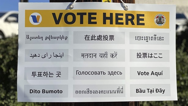 "Vote Here" sign "Vote Here" sign