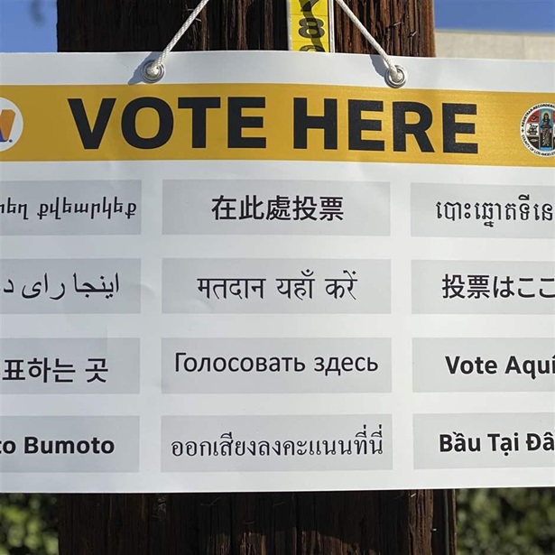 "Vote Here" sign "Vote Here" sign