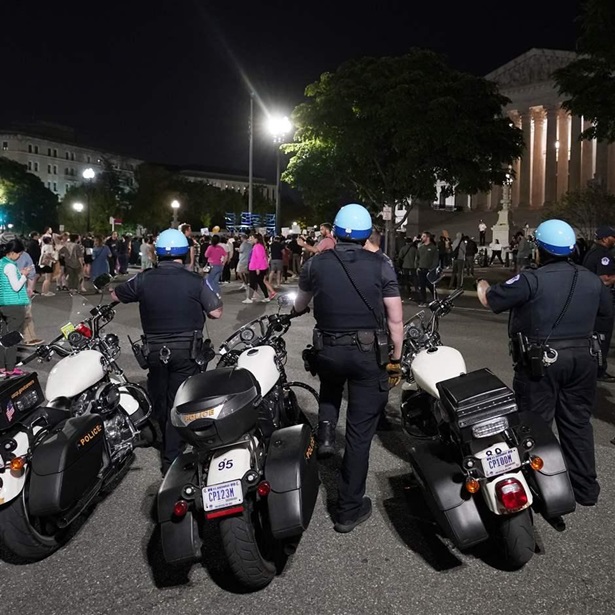 Police form a line outside the U.S. Supreme Court early Tuesday amid protesters Police form a line outside the U.S. Supreme Court early Tuesday amid protesters