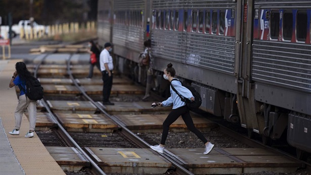 Passengers cross a SEPTA track Passengers cross a SEPTA track