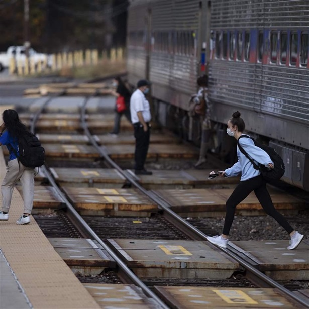 Passengers cross a SEPTA track Passengers cross a SEPTA track