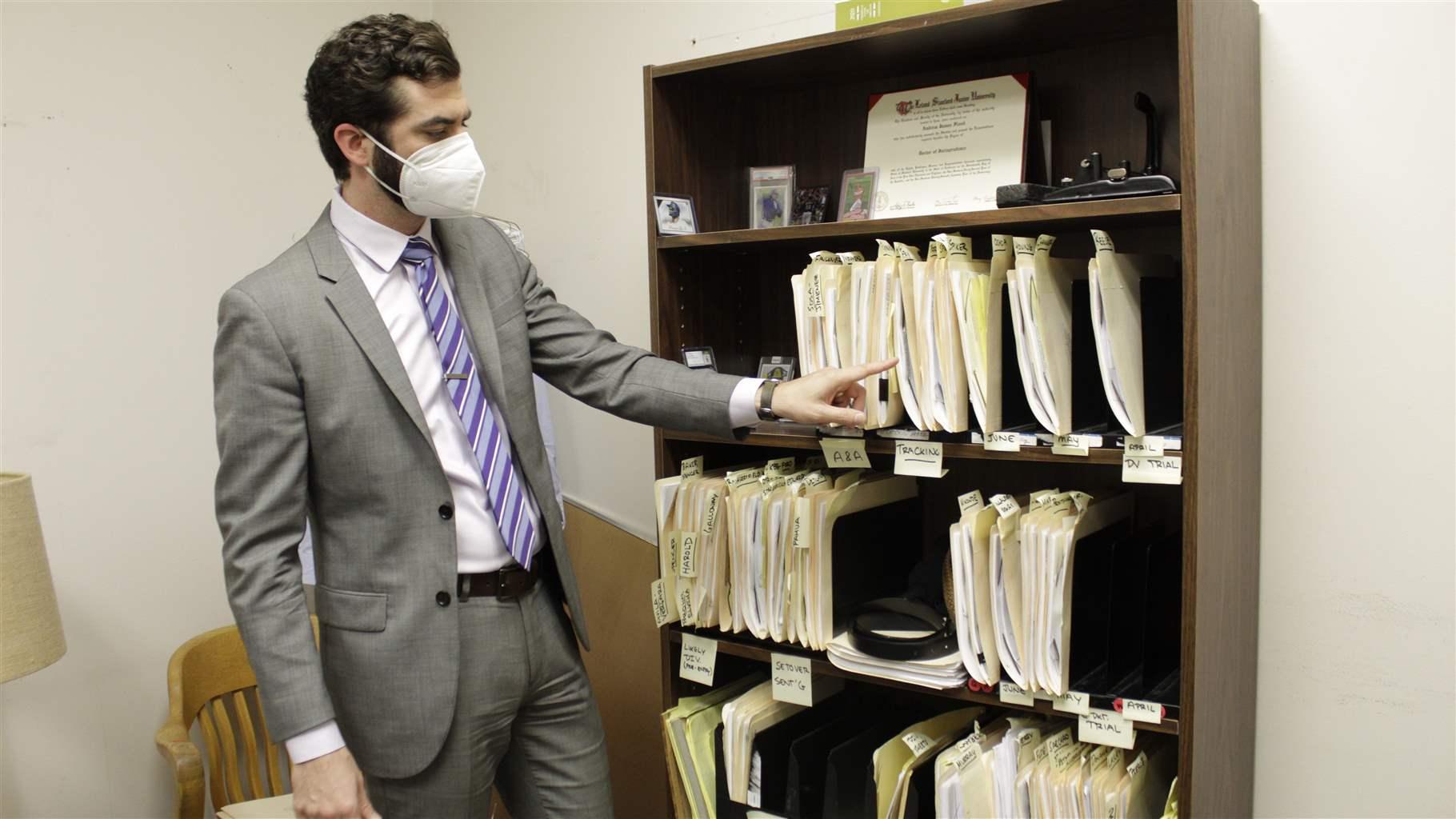 Public defender looking at case files Public defender looking at case files