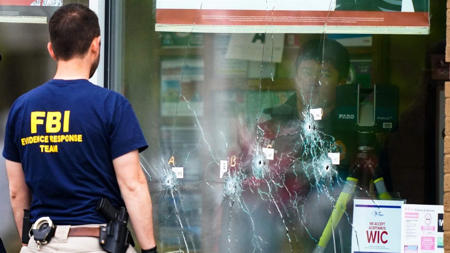 Investigators work the scene of a shooting at a supermarket in Buffalo, N.Y., Monday, May 16, 2022. Investigators work the scene of a shooting at a supermarket in Buffalo, N.Y., Monday, May 16, 2022.
