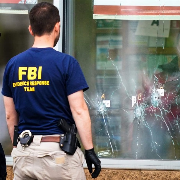Investigators work the scene of a shooting at a supermarket in Buffalo, N.Y., Monday, May 16, 2022. 