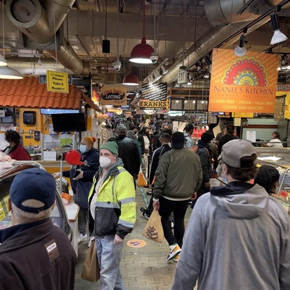 Shoppers are seen gathering inside the indoor Farmer's Market (since 1892) in Philadelphia, Pennsylvania, on March 19, 2021 amid the Coronavirus pandemic restrictions.