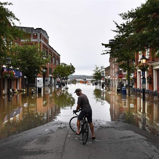 eff Bigler turns his bicycle around after taking in the scene of a tidal flooded King Street on Tuesday September 11, 2018 in Alexandria, VA.