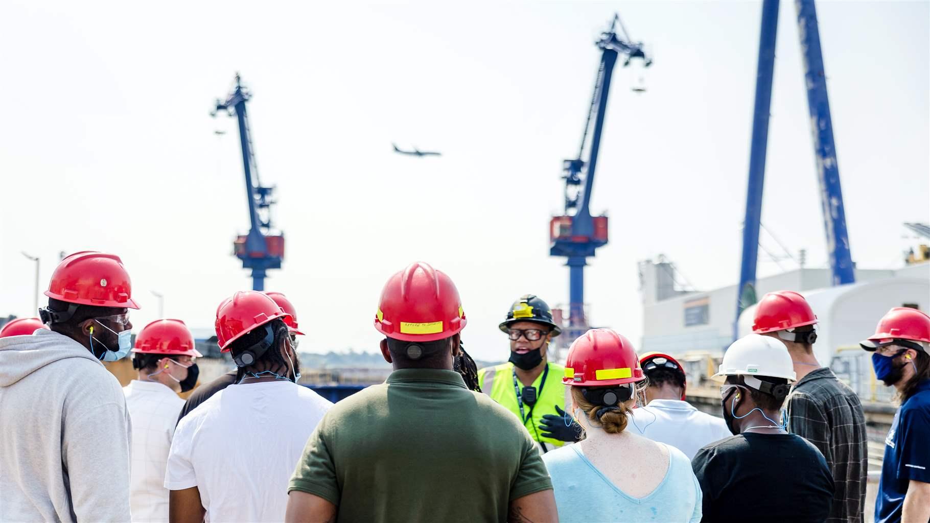 Participants in the West Philadelphia Skills Initiative’s Shipyard Apprentice Program receive a tour of the Philadelphia Shipyard as part of their training.