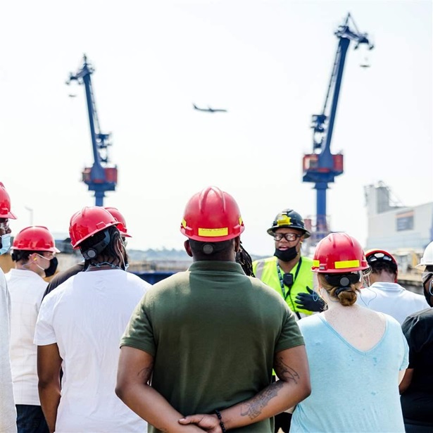 Participants in the West Philadelphia Skills Initiative’s Shipyard Apprentice Program receive a tour of the Philadelphia Shipyard as part of their training.