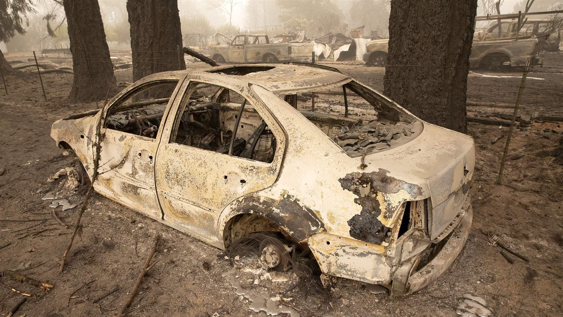 Flames from the Beachie Creek Fire melted the aluminum rims on a car near the destroyed Oregon Department of Forestry, North Cascade District Office in Lyons, Ore., Sunday, Sept. 13, 2020. 