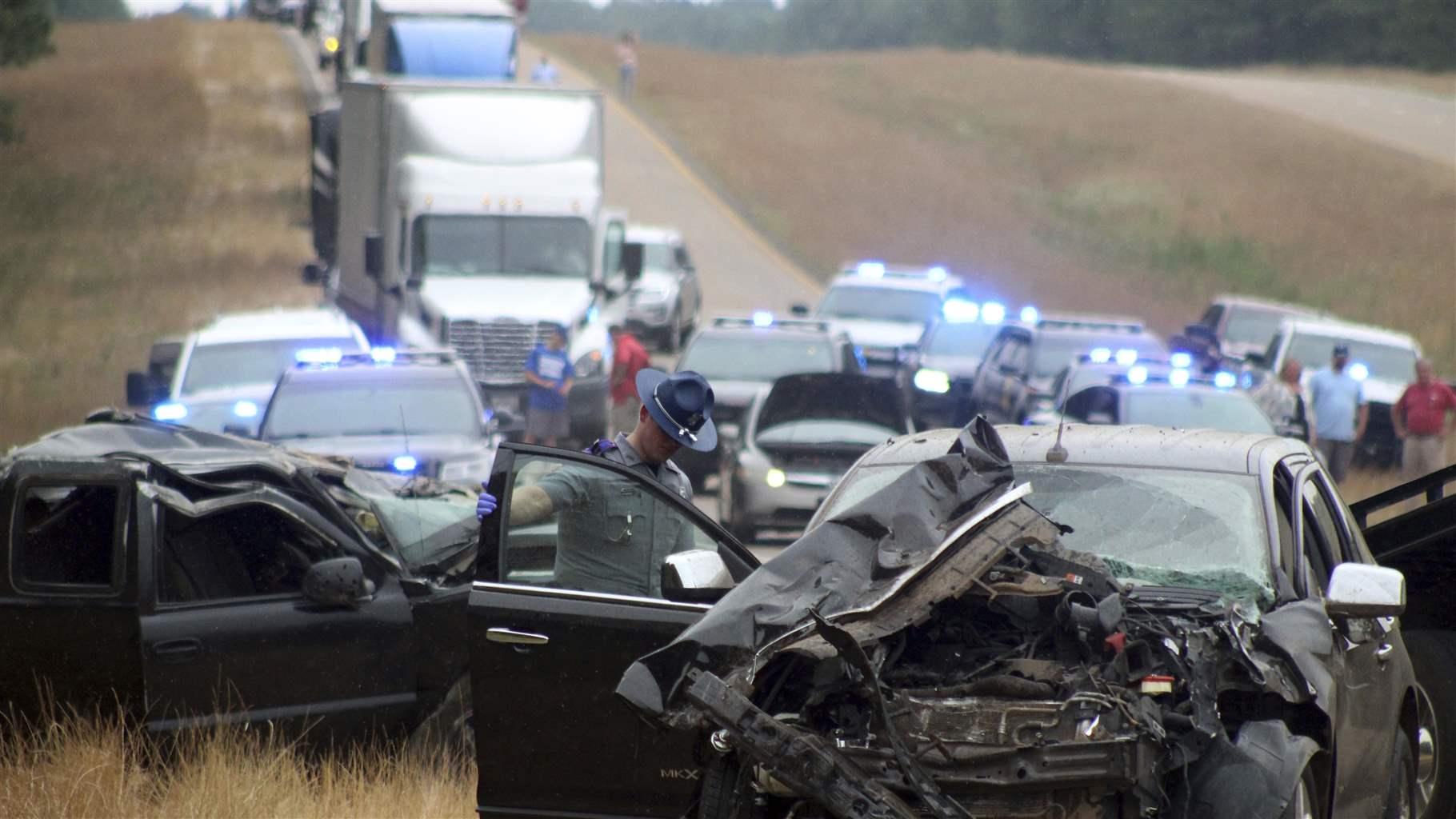 A Mississippi Highway Patrol state trooper investigates a wreck on U.S. Highway 45 south of Scooba in Kemper County, Miss., Wednesday, June 5, 2019. 