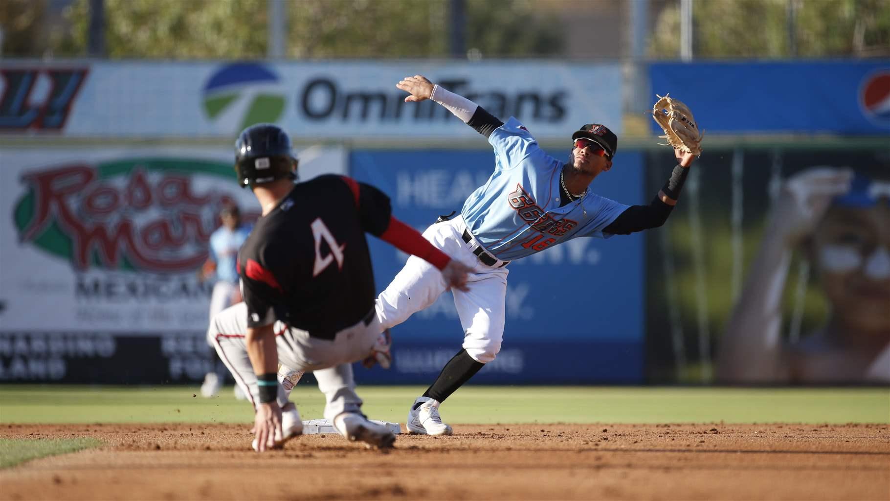Adrian Placencia (16) of the Inland Empire 66ers reaches for a wide throw against the Lake Elsinore Storm at San Manuel Stadium on August 28, 2022 in San Bernardino, California.