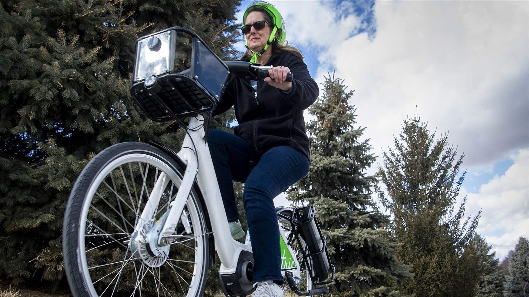 Pam Wisner of Valparaiso tries out one of five e-bikes available for a ride around Woods Park