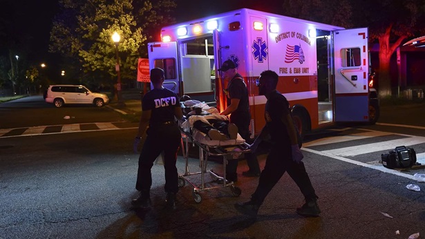 Fire and EMS personnel, with the help of Washington, D.C., police, transport a man feeling the effects of synthetic drugs to an ambulance. Overdose patients have at least a 1 in 10 chance of dying from a subsequent incident in the following year.