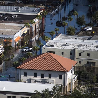 Homes and businesses are seen surrounded by flood water in the aftermath of Hurricane Irma in the San Marco neighborhood of Jacksonville, Fla. on Tuesday, Sept 12, 2017.