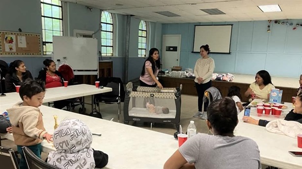 Guadalupe Franco, a community health worker and coordinator with Baltimore Health System, instructs new and expectant mothers on safe sleeping practices in an East Baltimore church last Thursday. The class is part of the city’s B’More for Healthy Babies, which has sharply cut Baltimore's infant mortality rate while reducing the racial disparity in infant deaths.