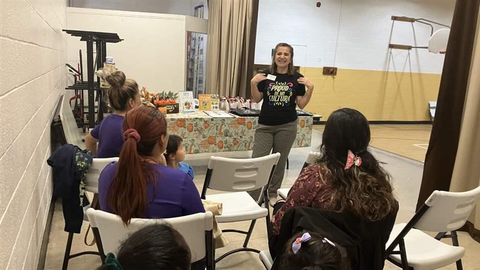 Maria Cruz, a nutritionist with the University of Maryland Extension, instructs a class of young or expectant mothers on healthy diets in an East Baltimore recreation center last Tuesday.
