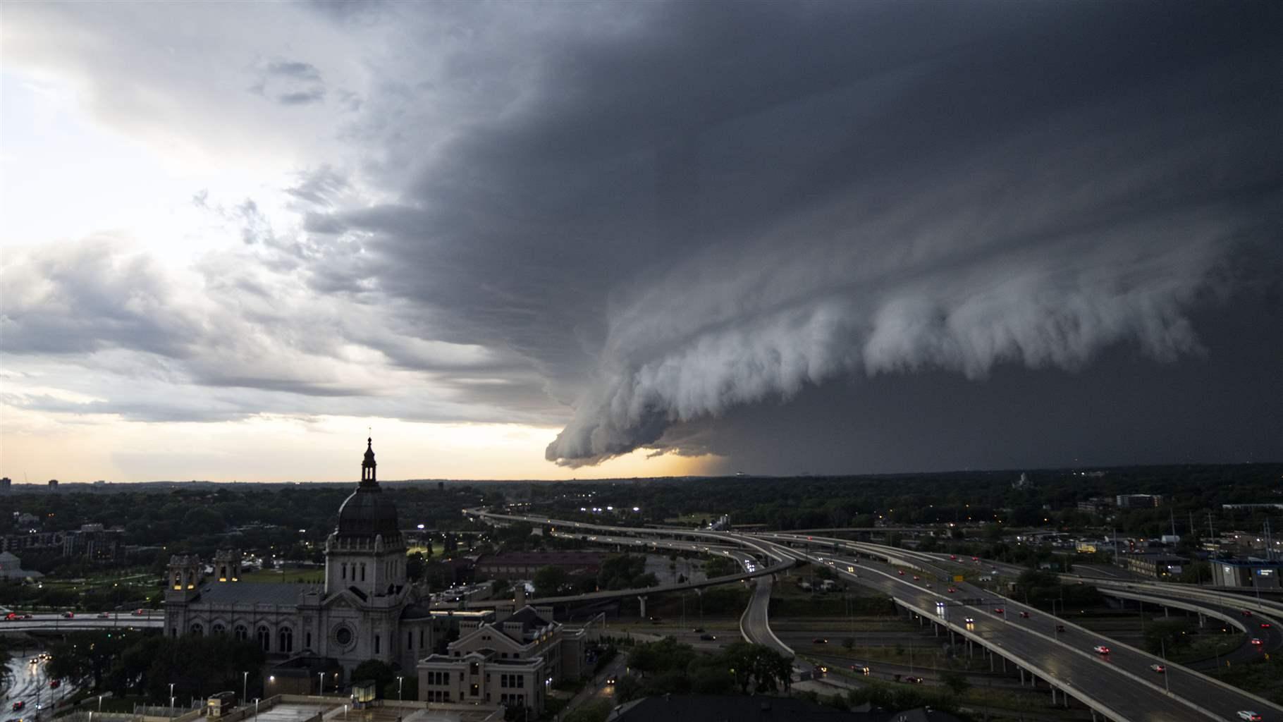 Storm clouds roll in Tuesday, July 12, 2022, over the Basilica of Saint Mary in Minneapolis.