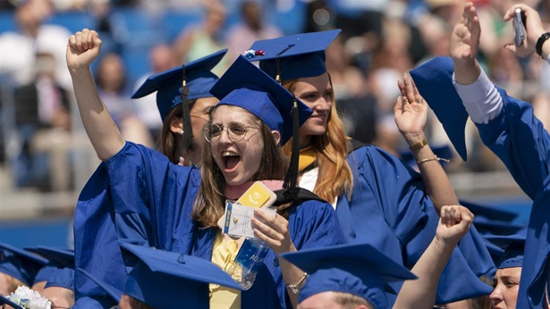 Graduates celebrate during the University of Delaware Class of 2022 commencement ceremony in Newark, Del., Saturday, May 28, 2022. The Department of Education says borrowers who hold eligible federal student loans and have made voluntary payments since March 13, 2020, can get a refund.(AP Photo/Manuel Balce Ceneta)
