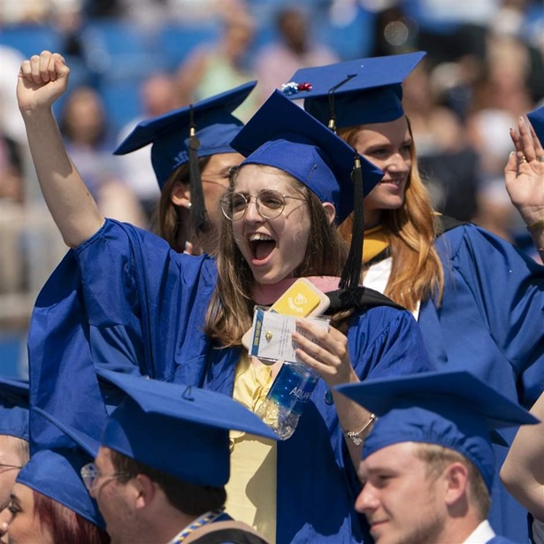 Graduates celebrate during the University of Delaware Class of 2022 commencement ceremony in Newark, Del., Saturday, May 28, 2022. The Department of Education says borrowers who hold eligible federal student loans and have made voluntary payments since March 13, 2020, can get a refund.(AP Photo/Manuel Balce Ceneta)