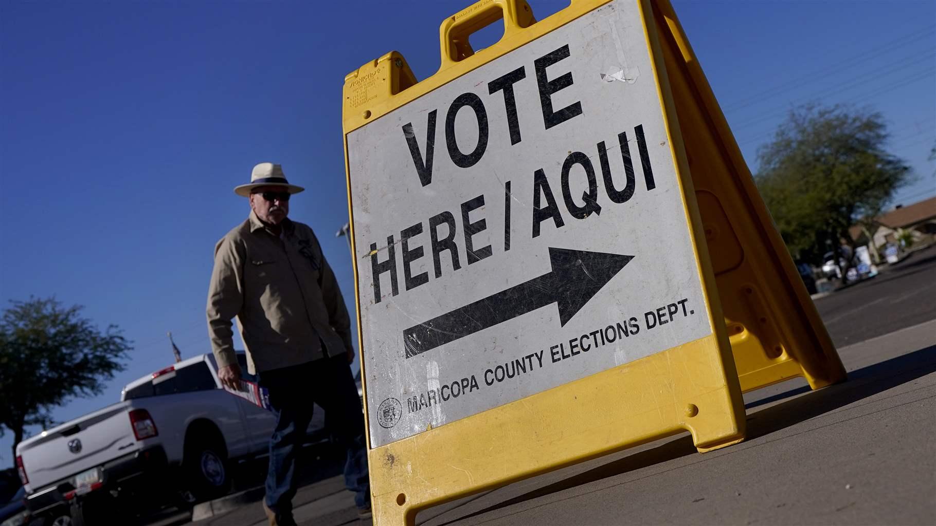 A voter arrives to cast his ballot at a precinct, Tuesday, Nov. 8, 2022, in Guadalupe, Ariz. (AP Photo/Matt York)