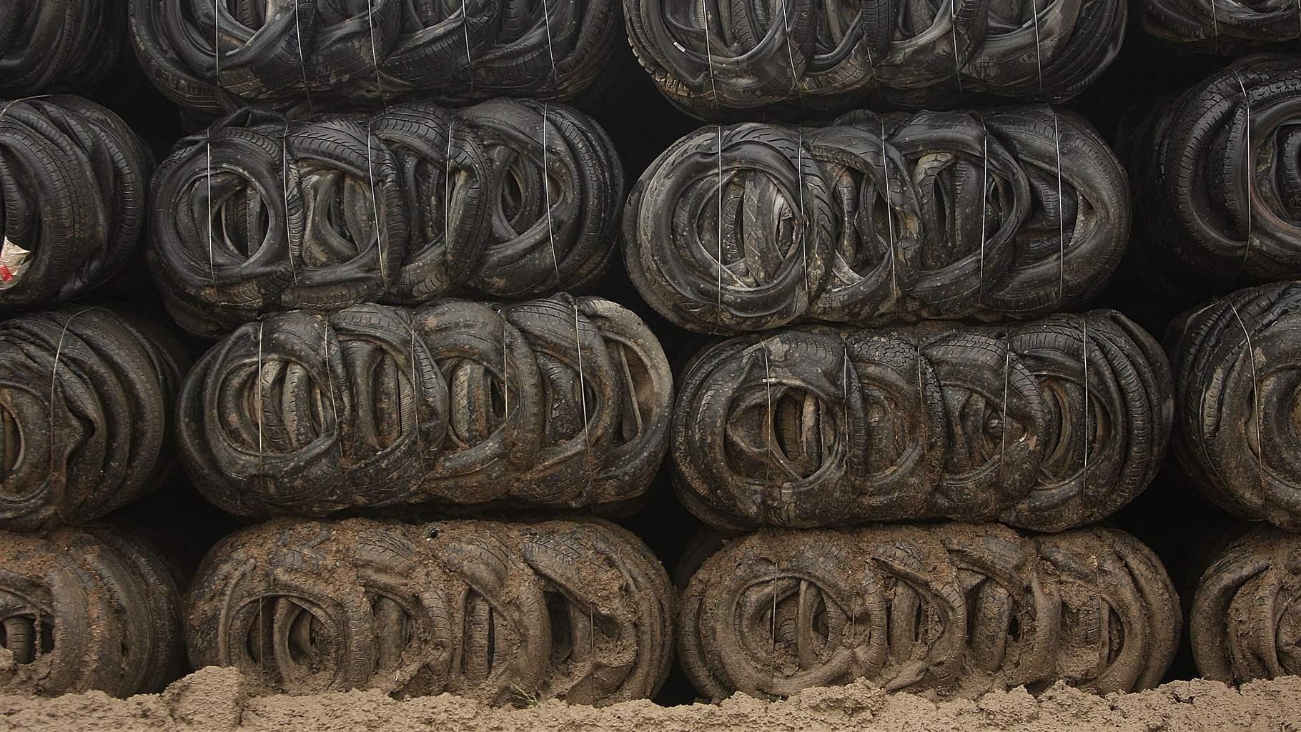 Bales of mud splashed tyres